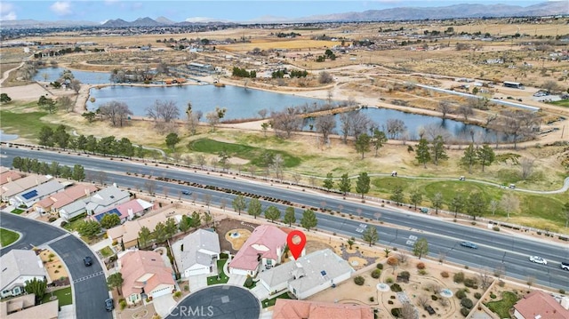 birds eye view of property featuring a water and mountain view