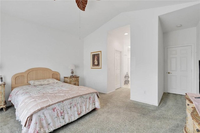 carpeted bedroom featuring lofted ceiling