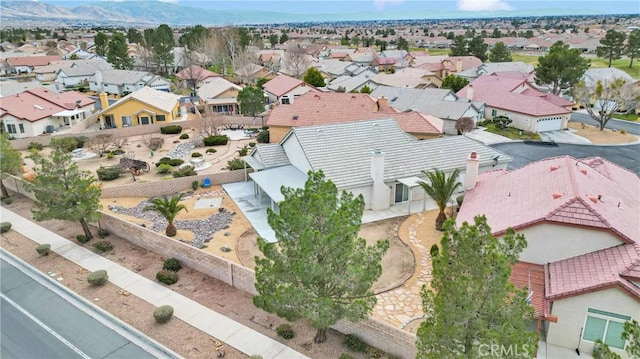 birds eye view of property featuring a mountain view