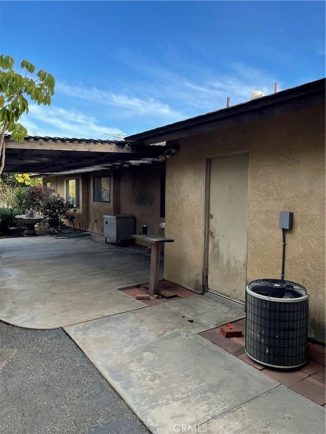 view of patio with central AC unit