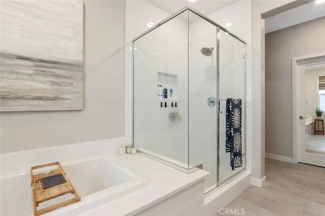 27717 Knoll View Pl, Valencia, CA 91381 - bathroom featuring tile patterned floors, a garden tub, and a stall shower
