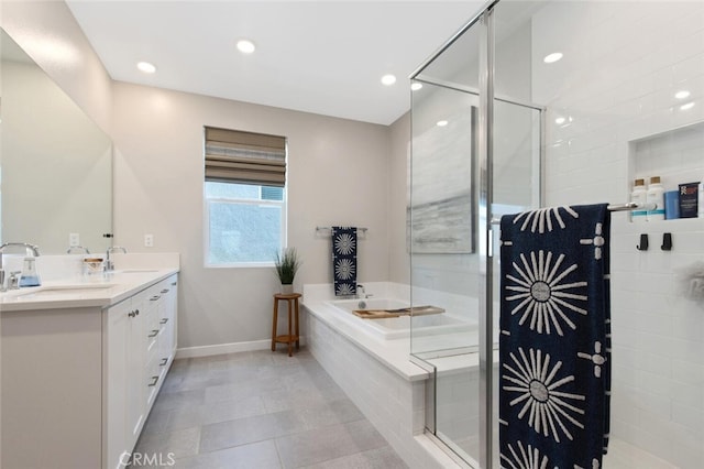 27717 Knoll View Pl, Valencia, CA 91381 - full bath with a garden tub, double vanity, baseboards, a sink, and a stall shower