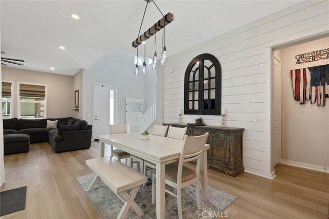 27717 Knoll View Pl, Valencia, CA 91381 - dining area featuring wood walls, stairway, baseboards, light wood-style floors, and recessed lighting