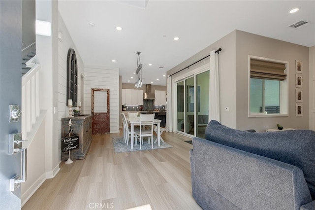 27717 Knoll View Pl, Valencia, CA 91381 - living room with stairs, recessed lighting, visible vents, and light wood-style floors