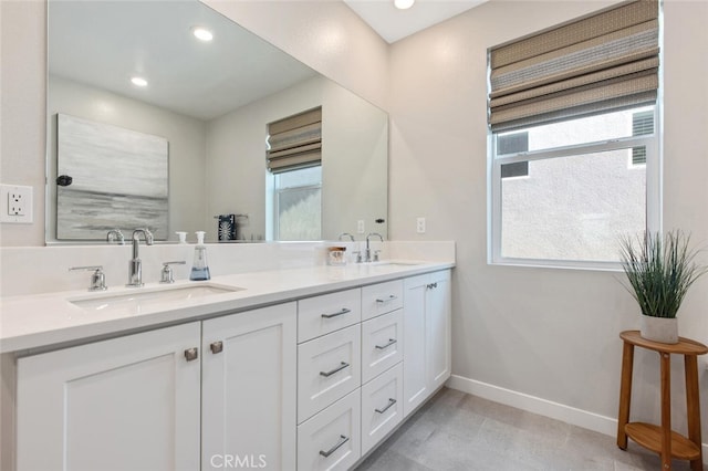 27717 Knoll View Pl, Valencia, CA 91381 - bathroom with baseboards, plenty of natural light, and a sink