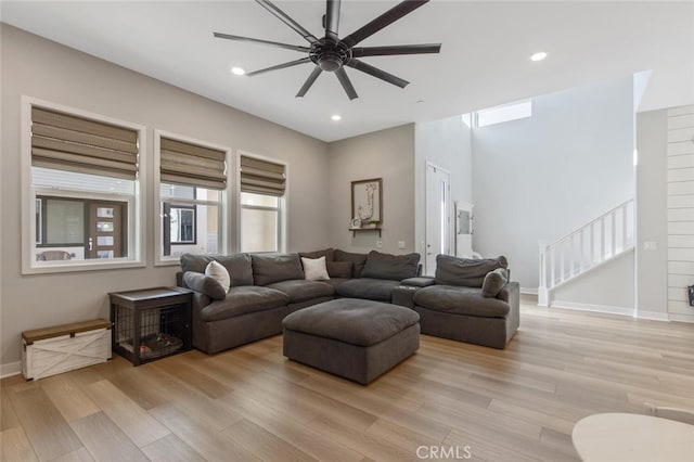 27717 Knoll View Pl, Valencia, CA 91381 - living area featuring light wood-style flooring, stairs, a ceiling fan, baseboards, and recessed lighting