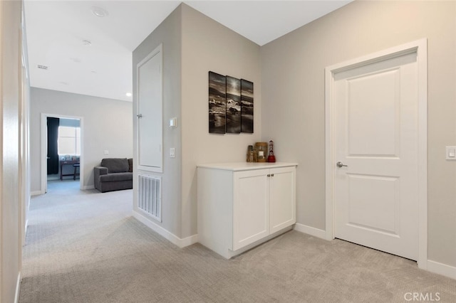 27717 Knoll View Pl, Valencia, CA 91381 - hallway with light colored carpet, baseboards, and visible vents