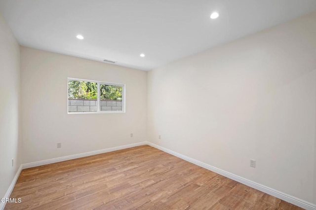 unfurnished room featuring light hardwood / wood-style flooring