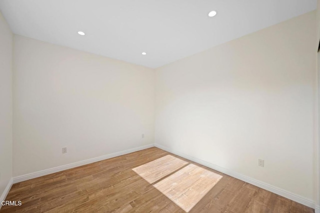 empty room with wood-type flooring