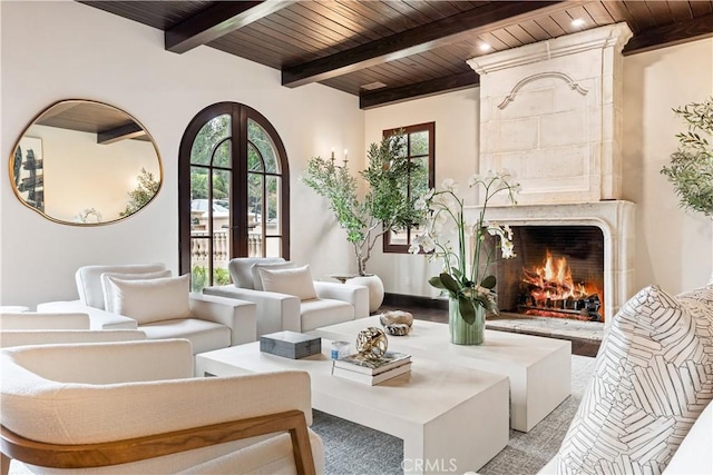 interior space featuring wooden ceiling, a premium fireplace, and french doors