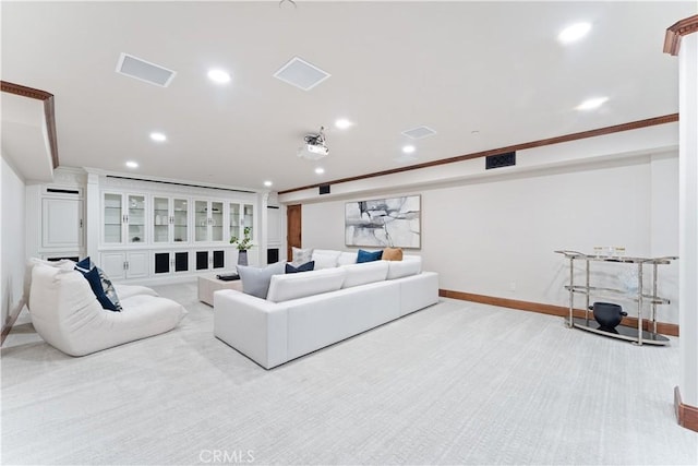 living room with recessed lighting, carpet flooring, visible vents, baseboards, and ornamental molding