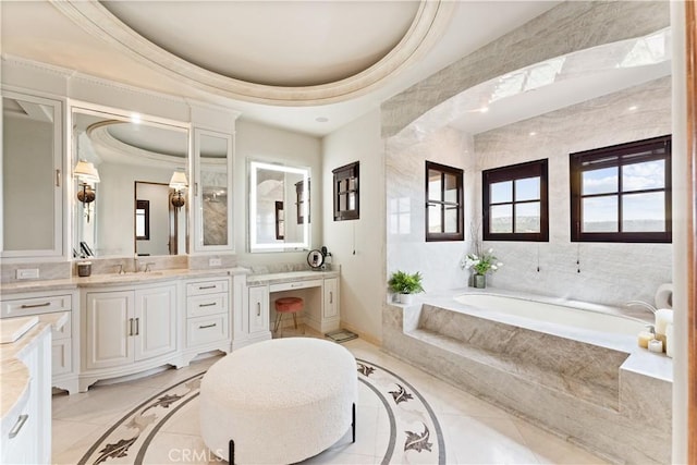 bathroom featuring ornamental molding, tile patterned floors, vanity, and a bath