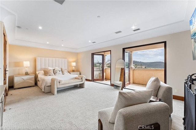 bedroom with access to exterior, baseboards, visible vents, and light colored carpet