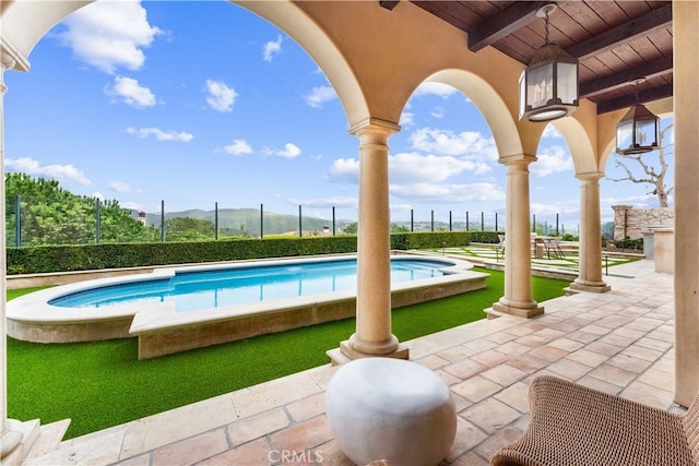 view of pool featuring a fenced in pool, a patio area, and fence