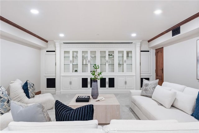 living room featuring recessed lighting, visible vents, and crown molding