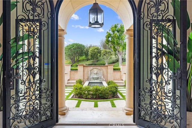 entryway with arched walkways