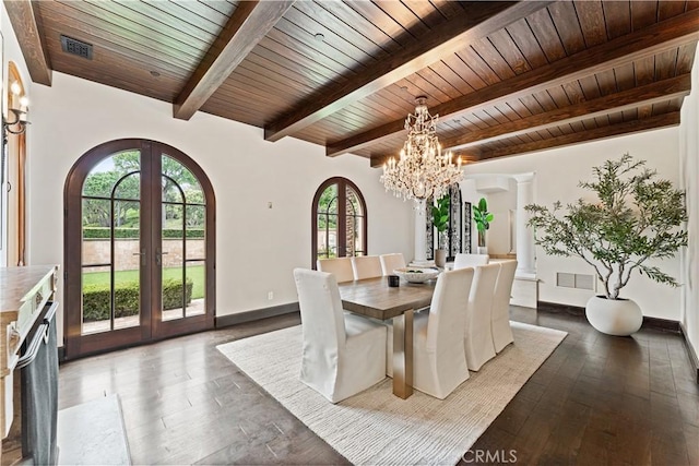 dining area featuring arched walkways, french doors, visible vents, and baseboards