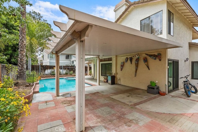 view of swimming pool with a patio, a fenced backyard, and a fenced in pool