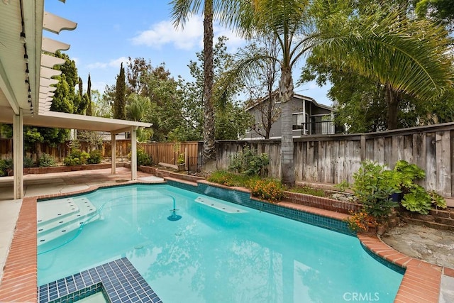view of pool featuring a patio area, a fenced backyard, and a fenced in pool