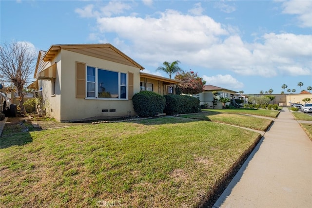 view of front facade featuring crawl space, a residential view, a front lawn, and stucco siding