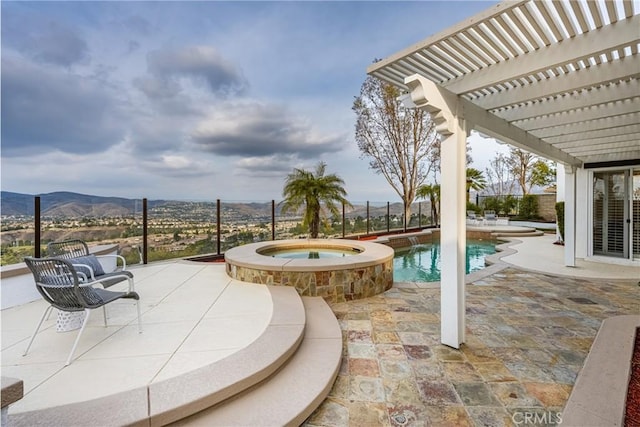 view of patio / terrace featuring a mountain view, a pergola, and a swimming pool with hot tub