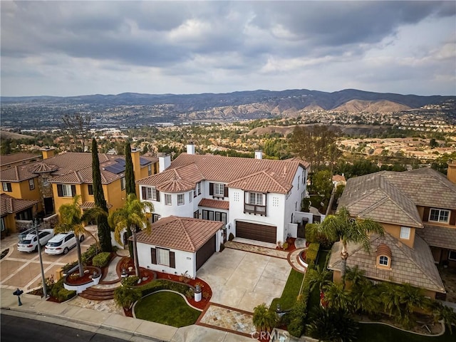 drone / aerial view featuring a residential view and a mountain view