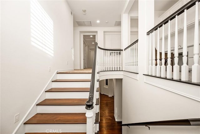 staircase featuring recessed lighting and wood finished floors