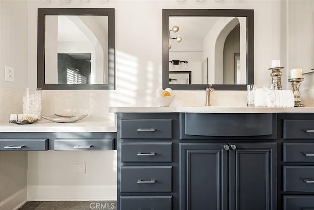 bathroom featuring baseboards and vanity