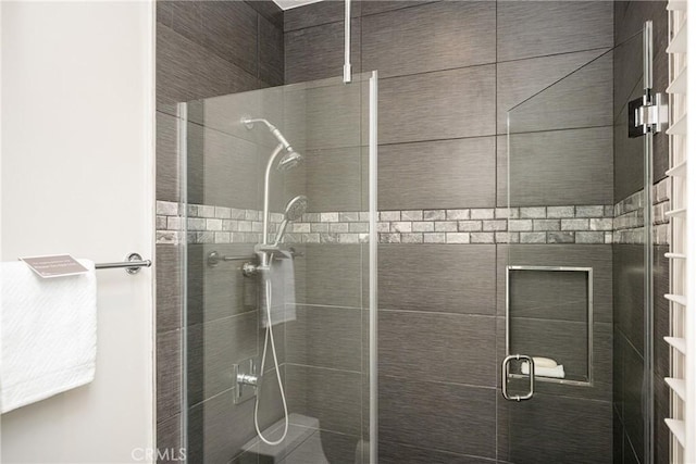 full bath featuring a shower stall