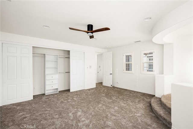 unfurnished bedroom featuring a ceiling fan, recessed lighting, a closet, and dark carpet