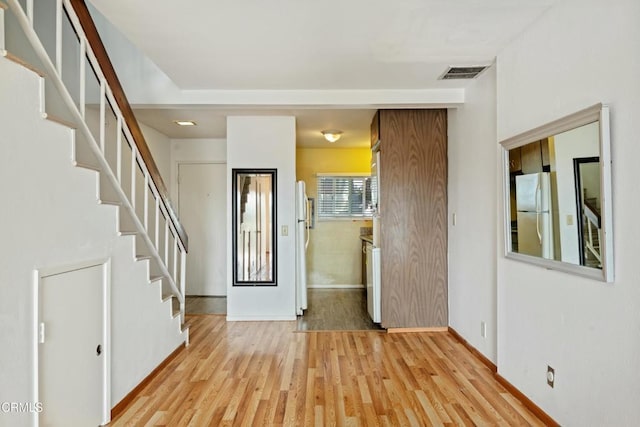 foyer with light hardwood / wood-style floors