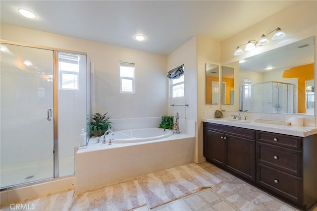 bathroom featuring plus walk in shower and vanity