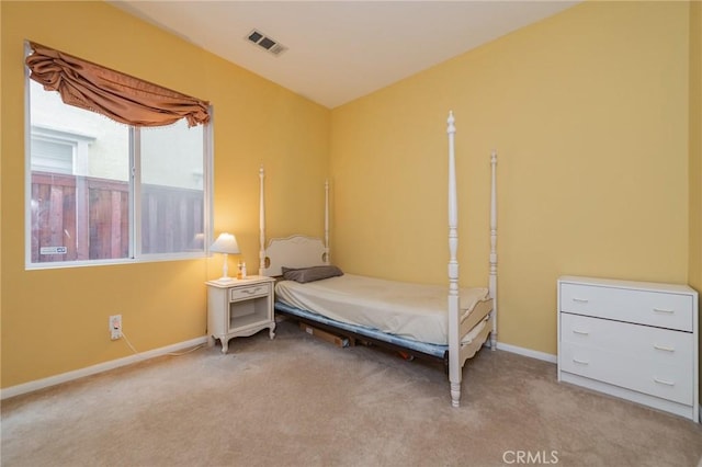 bedroom with light colored carpet