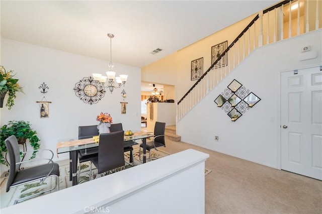 carpeted office featuring an inviting chandelier