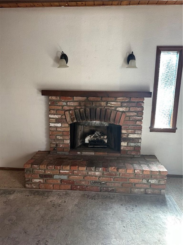 room details with a brick fireplace and carpet flooring