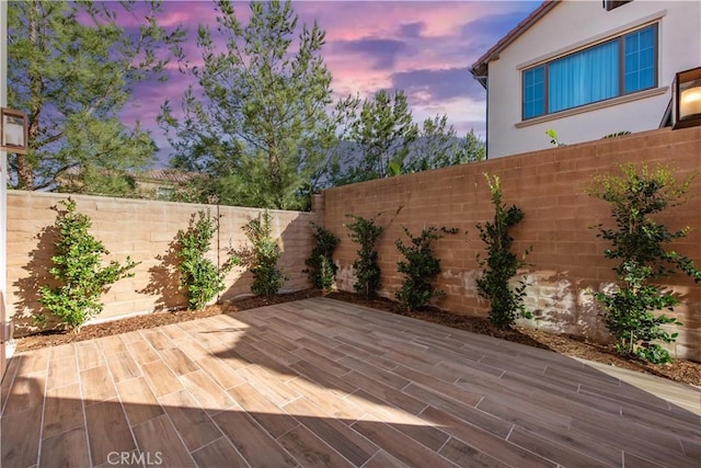 view of patio terrace at dusk