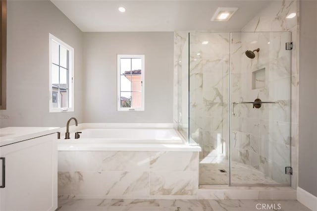 bathroom featuring plus walk in shower and vanity