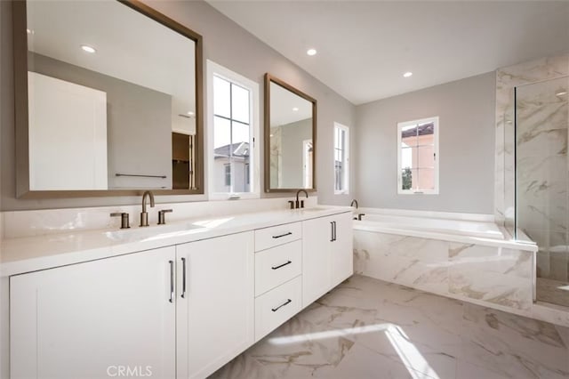 bathroom with separate shower and tub and vanity