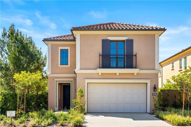 122 Appian Blvd, Irvine, CA 92602 - view of front of home with a tiled roof, a balcony, stucco siding, concrete driveway, and a garage