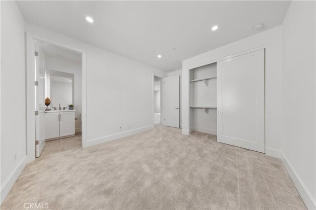 122 Appian Blvd, Irvine, CA 92602 - unfurnished bedroom with a closet, connected bathroom, light carpet, baseboards, and recessed lighting