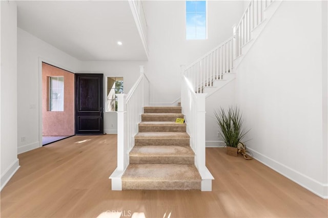 122 Appian Blvd, Irvine, CA 92602 - foyer entrance with wood finished floors, a wealth of natural light, baseboards, and stairway