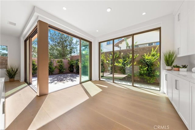 122 Appian Blvd, Irvine, CA 92602 - doorway to outside with recessed lighting, visible vents, and light wood finished floors