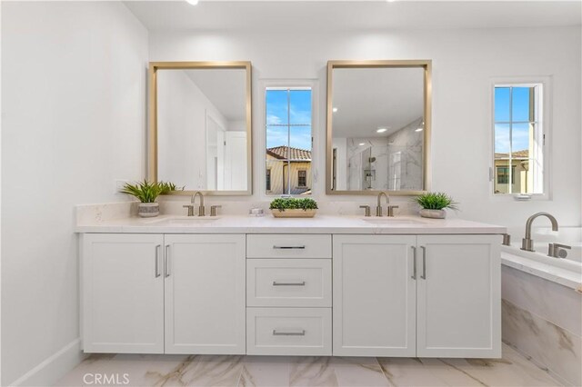 122 Appian Blvd, Irvine, CA 92602 - bathroom with double vanity, marble finish floor, a marble finish shower, and a sink