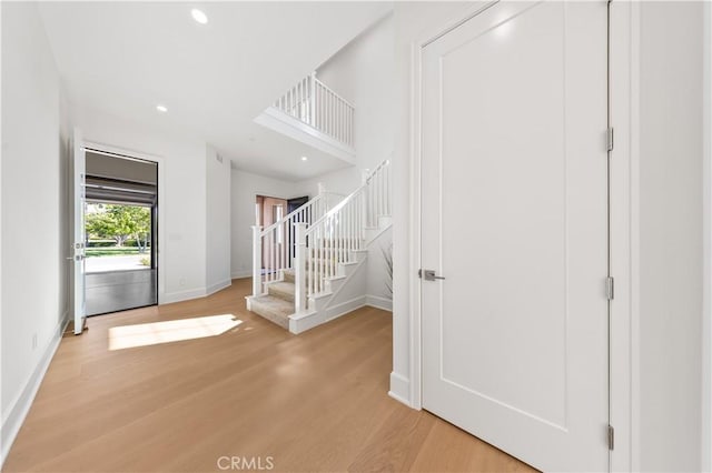 122 Appian Blvd, Irvine, CA 92602 - entryway featuring recessed lighting, light wood-style flooring, baseboards, and stairway