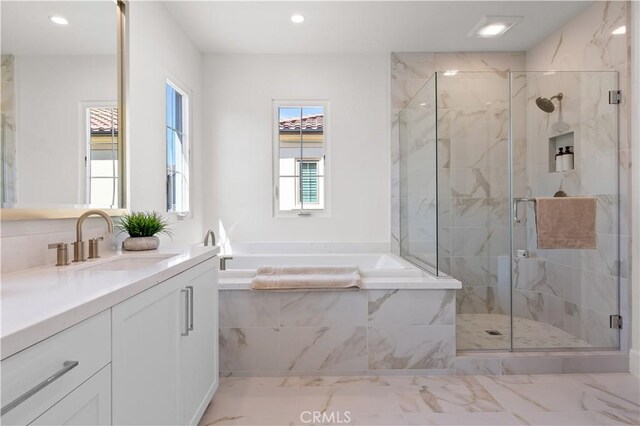 122 Appian Blvd, Irvine, CA 92602 - bathroom featuring a garden tub, marble finish floor, vanity, and a marble finish shower
