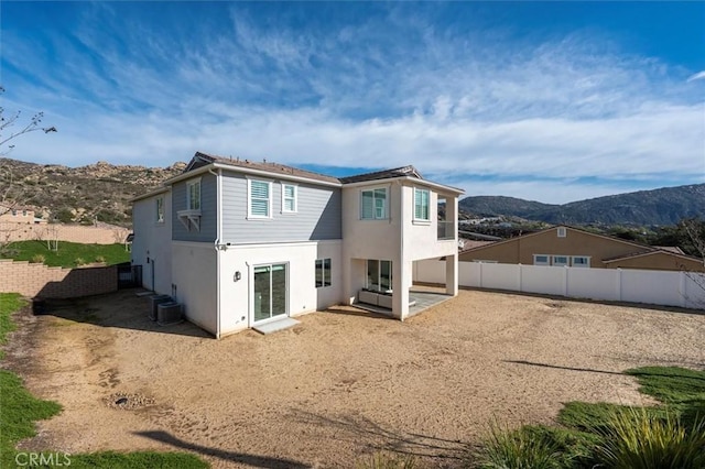 back of property featuring a mountain view