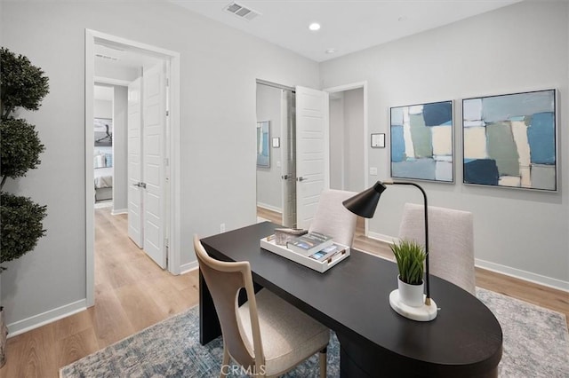 home office featuring light hardwood / wood-style flooring