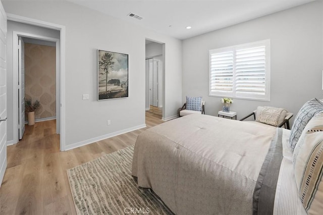 bedroom with light hardwood / wood-style floors