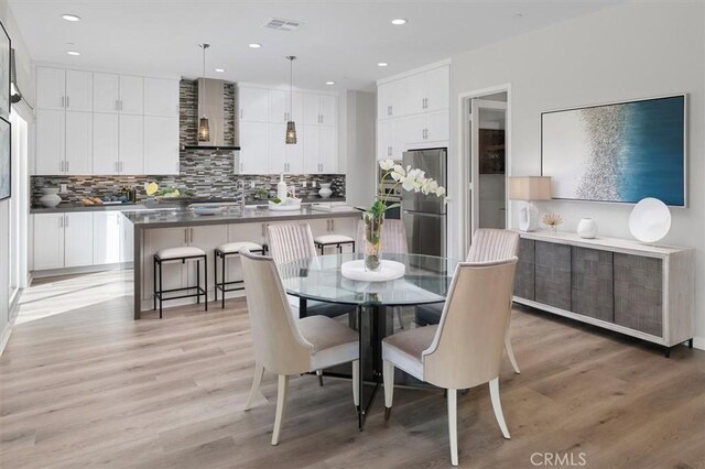 dining area featuring hardwood / wood-style floors