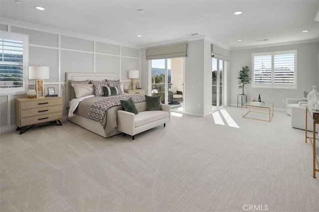 bedroom with access to exterior, crown molding, and light colored carpet